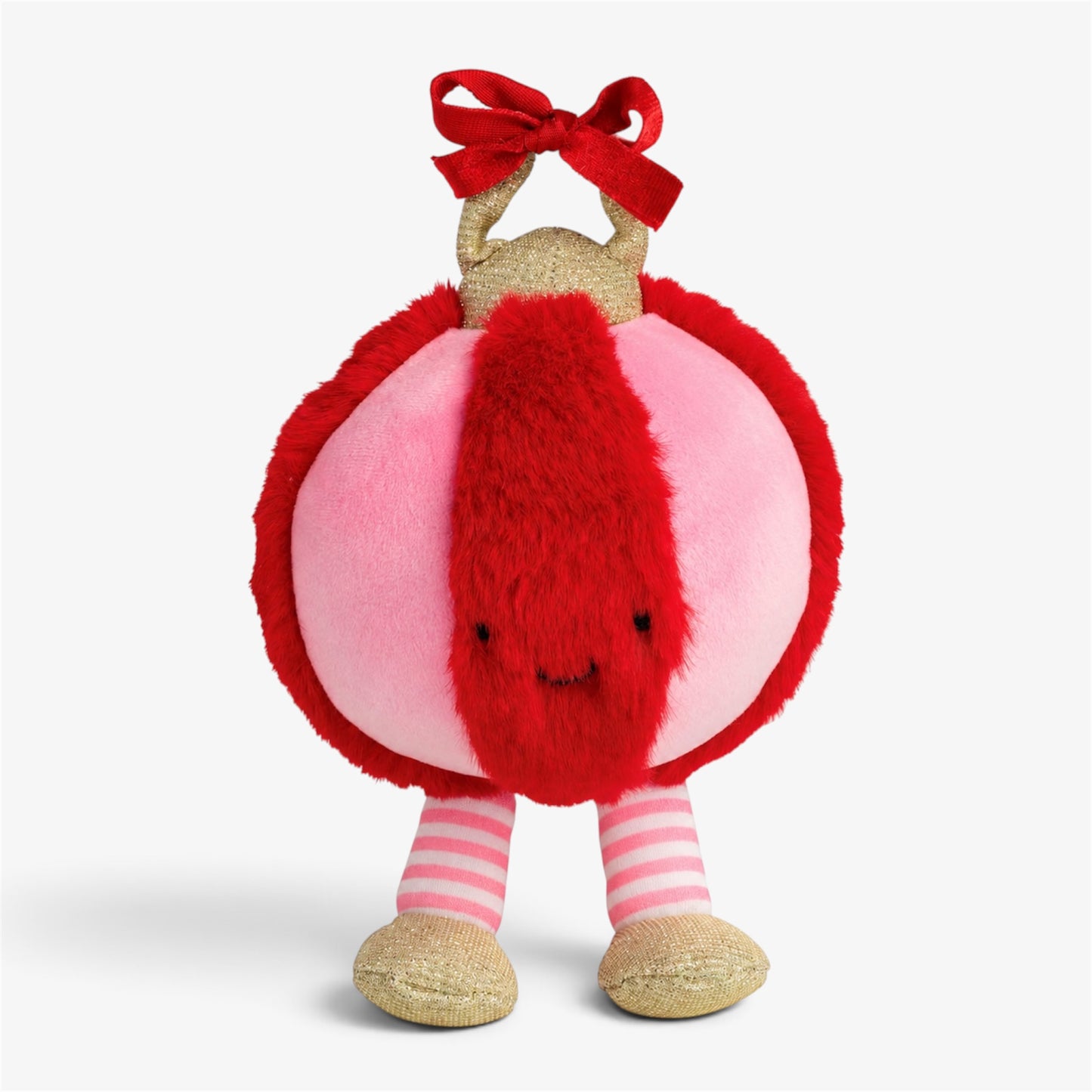 Glitzy pink and red plush Christmas ornament character with a red bow, gold hanging loop, fluffy red center stripe, pink-and-white striped legs, and gold shoes.