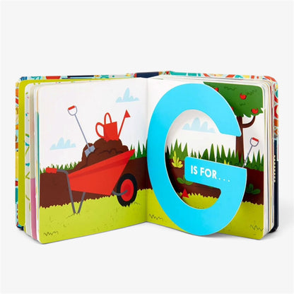 An open children's pop-up alphabet book showing the letter G. The page features a large blue 3D letter G with the text 'IS FOR.