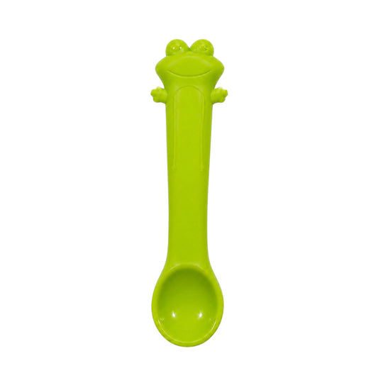 Green frog-shaped silicone baby spoon on white background.