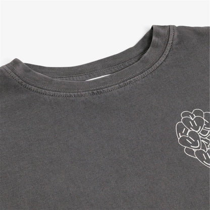 Close-up of gray girls’ organic cotton T-shirt with ribbed neckline and heart detail pictured on white background