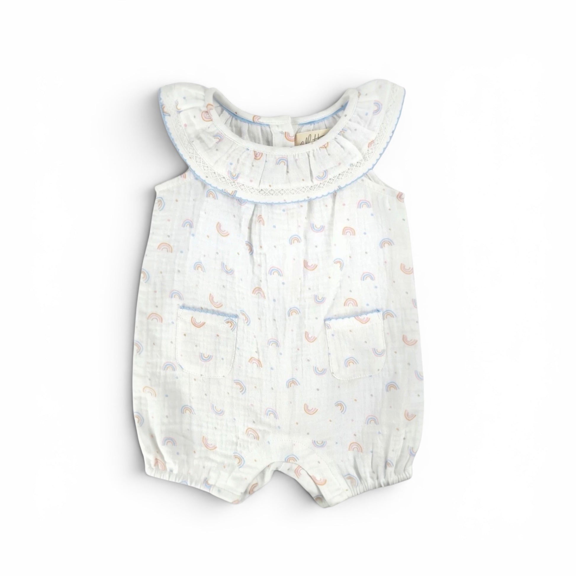 Mini rainbow baby romper made from organic cotton with ruffle collar and lace trim