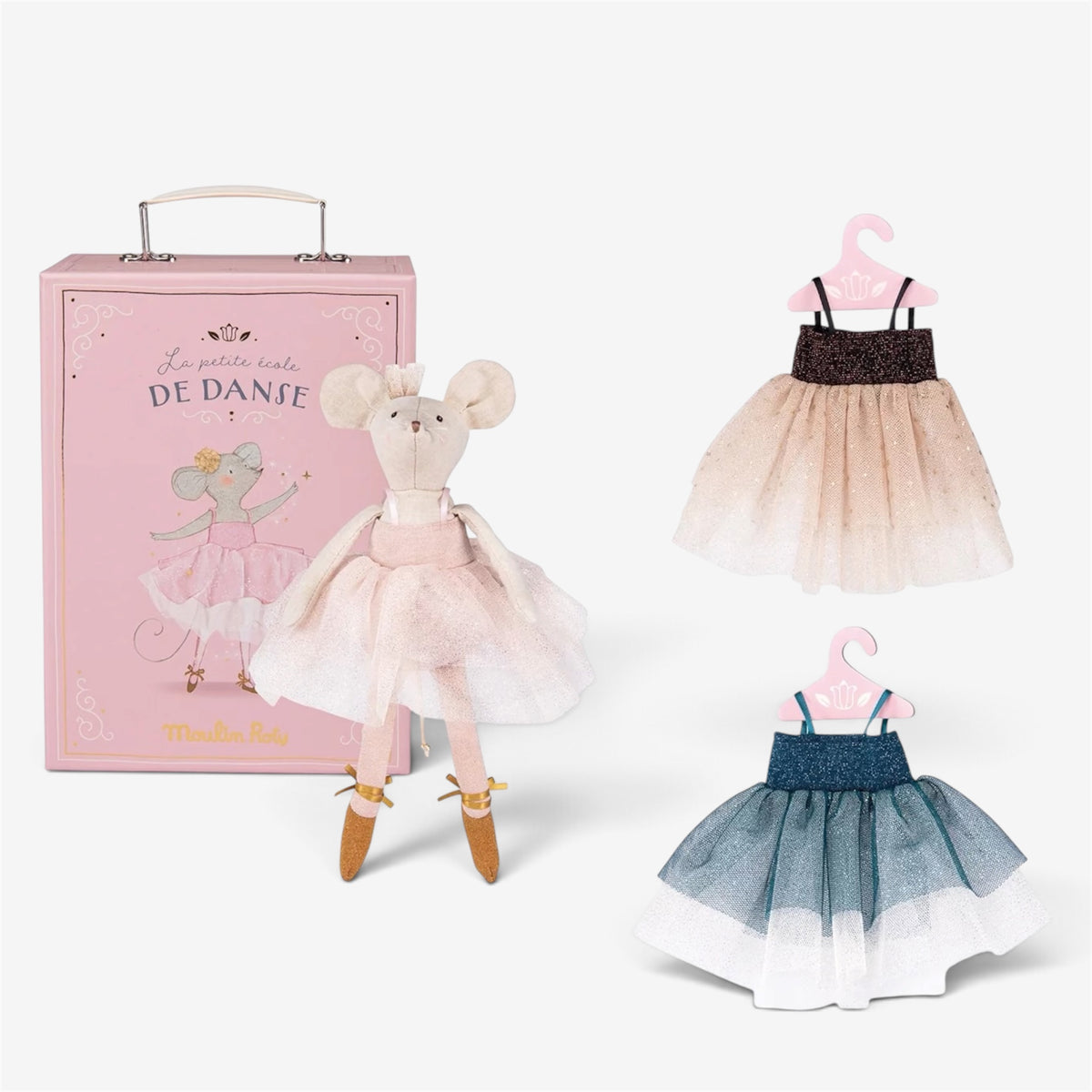 A doll dressed as a ballerina stands beside a pink storage box, with two small ballerina dresses on hangers to the right. The doll has a pale pink tutu, tan shoes, and a mouse head.