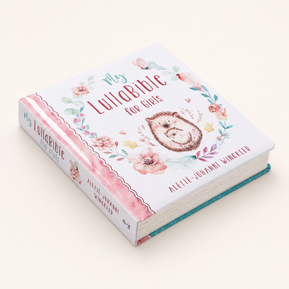 Angled view of My LullaBible for Girls padded board book showing the floral cover, pink spine, and thick pages