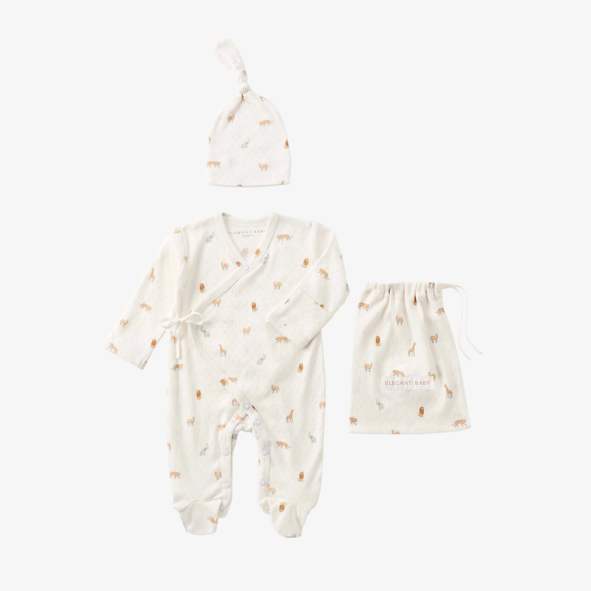 Baby clothing set with romper, hat, and bag on a white background