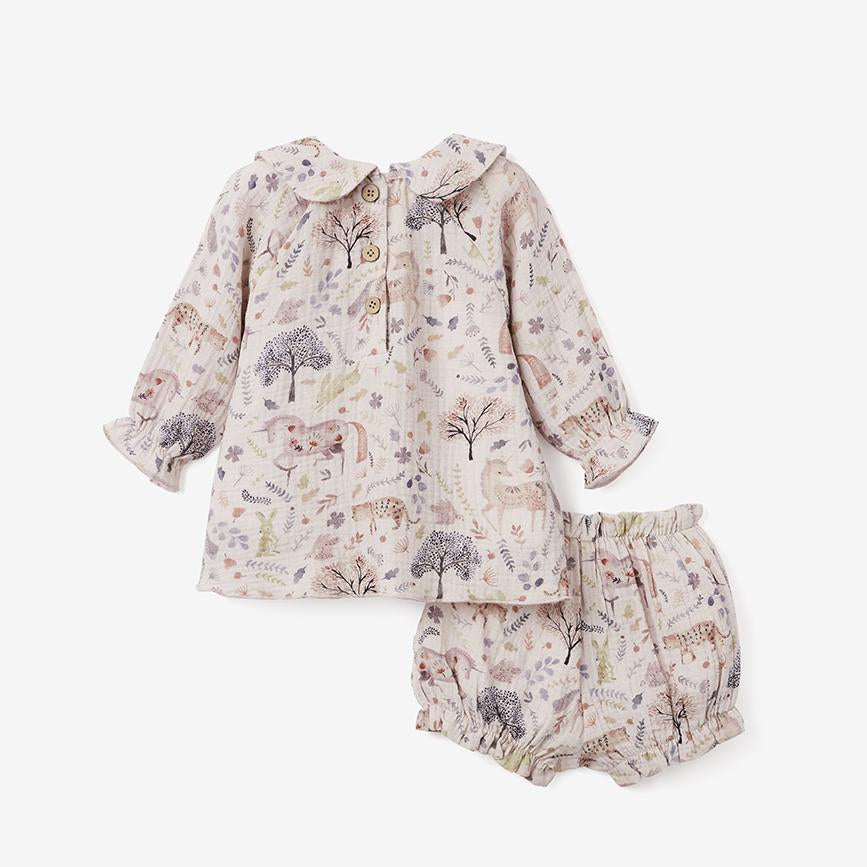 A floral and unicorn-themed baby matching set consisting of a dress and bloomer with a ruffled collar and elasticized ruffle detail on sleeves on white background