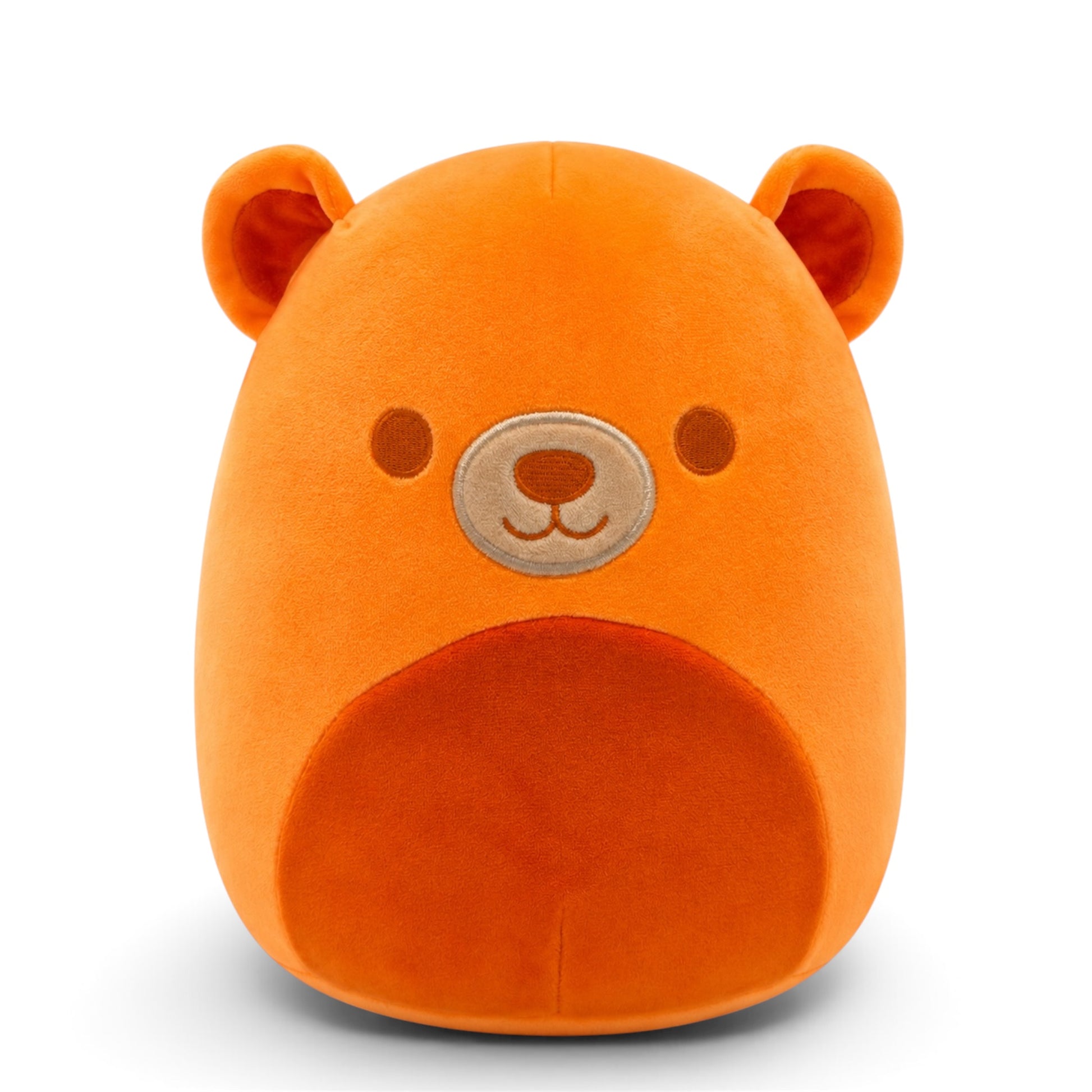 An orange plush bear head pillow with embroidered facial features, photographed against a clean white background.