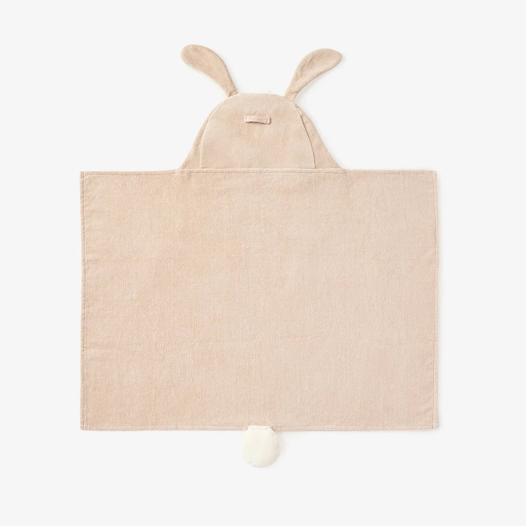 Beige hooded towel for babies, featuring bunny ears on the hood and a small white pom-pom at the bottom, shown flat against a white background.