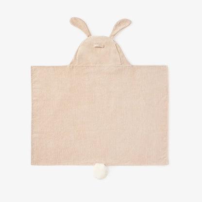 Beige hooded towel for babies, featuring bunny ears on the hood and a small white pom-pom at the bottom, shown flat against a white background.