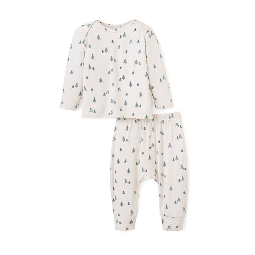 Cream color bamboo baby pajama set with long-sleeve lap-shoulder top and pull-on pants with green christmas tree print all over front view on white background 