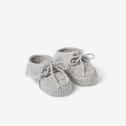 Pair of gray hand-crocheted cotton moccasin baby booties on white background