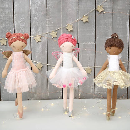 Handmade fairy dolls displayed together for nursery décor and gifting