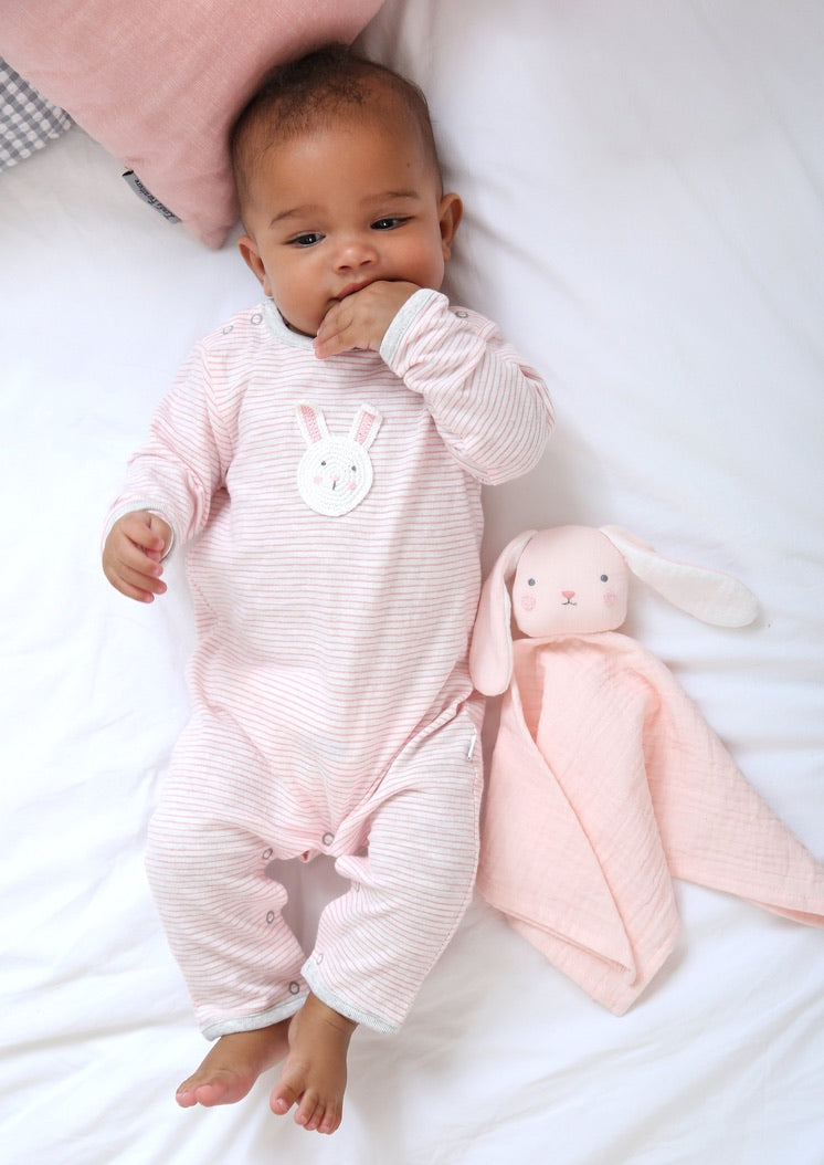 Baby wearing pink striped organic cotton bunny romper