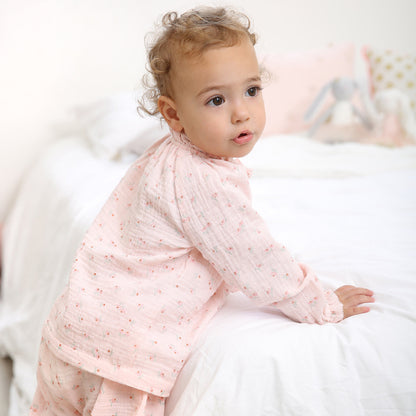 Baby wearing Sparkle Floral Print Gauze Playset featuring soft organic cotton floral fabric and vintage inspired details